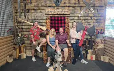 Group posing with weapons at Dungeon Throwers.