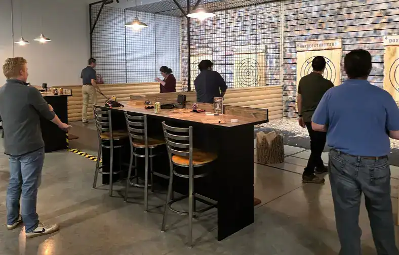 Corporate group throwing axes at Dungeon Throwers.