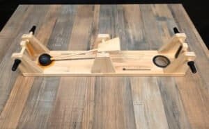 This wooden game is all about keeping the ball off your side. Flick it back and forth with another player. A free game to play at Dungeon Throwers in Madison.