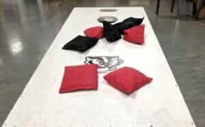 Homemade cornhole boards with an added 5-hole for extra challenge. Enjoy the fun at Dungeon Throwers in Madison.