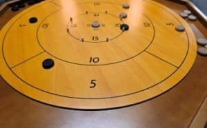Maybe the best game at Dungeon Throwers. Think curling and shuffleboard but on a tabletop. Flick your disk at opposing disks to score the most points each round.