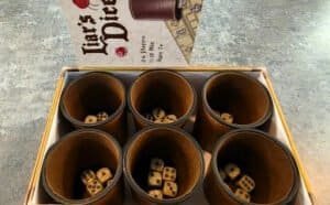 Six-player dice game where you roll dice and wager against the other players. A free game to play while at Dungeon Throwers in Madison.